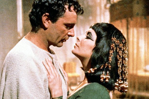 Elizabeth Taylor as Cleopatra, alongside Richard Burton as Mark Antony in Cleopatra (1963) (Image Credits: Wales Online)