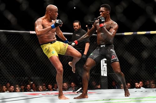 Anderson Silva of Brazil kicks Israel Adesanya of Nigeria