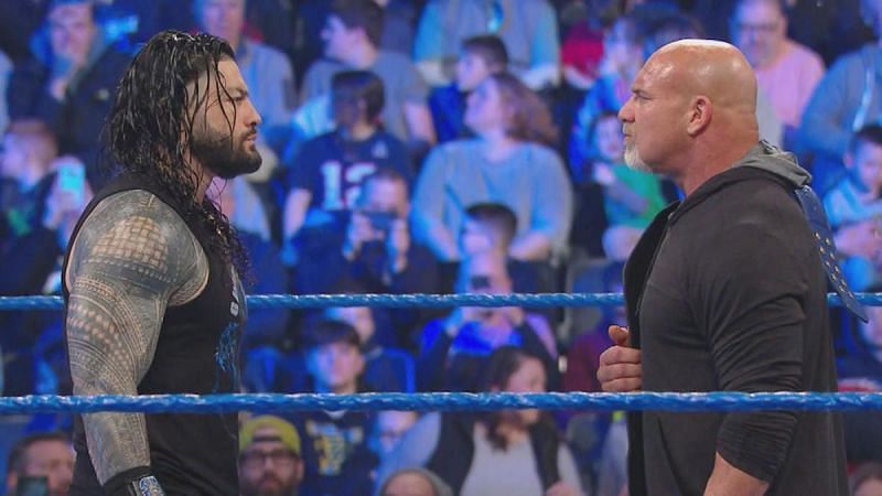 Goldberg and Roman Reigns