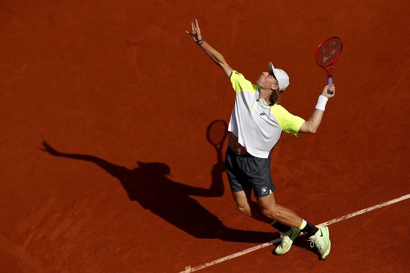 Denis Shapovalov serves at the French Open