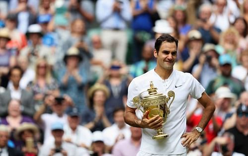 Roger Federer celebrates with the Wimbledon trophy following his victory in the 2017 final.