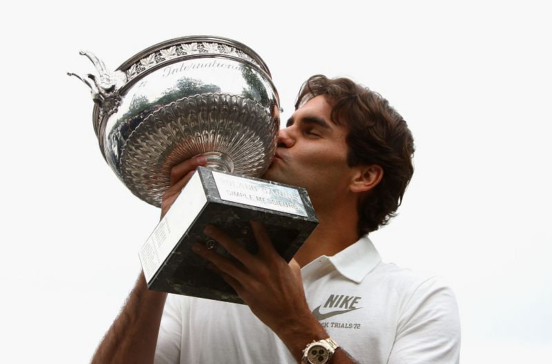 Roger Federer of Switzerland with the French Open winners trophy in June 2009