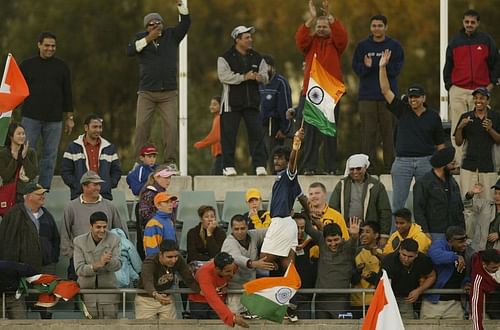 Dhanraj Pillay of India celebrates with fans