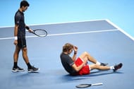 Novak Djokovic heads to congratulate Alexander Zverev after losing to him