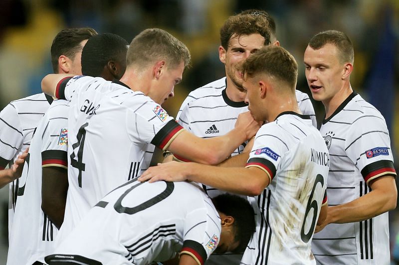 Ginter celebrates with his teammates after scoring a goal