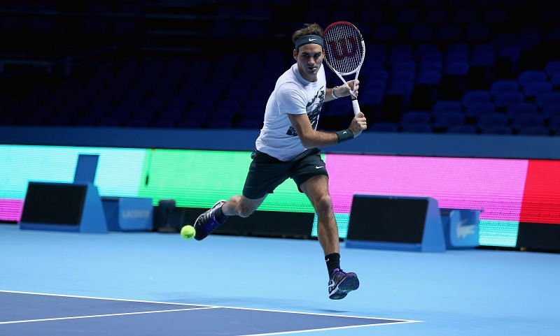 Roger Federer gliding across the court