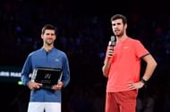 Novak Djokovic(L) and Karen Khachanov at the 2018 Paris Masters