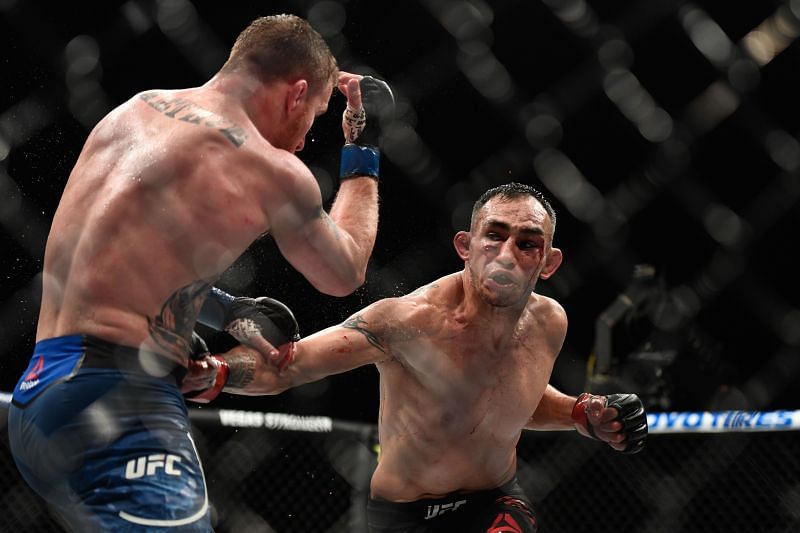 Tony Ferguson (R) looks to punch Justin Gaethje (L)