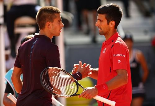 Borna Coric (L) and Novak Djokovic