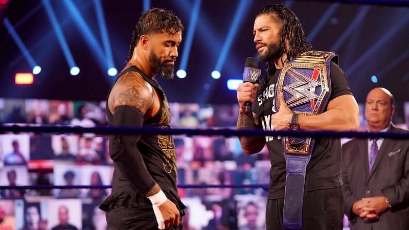 Jey Uso getting told off by Roman Reigns