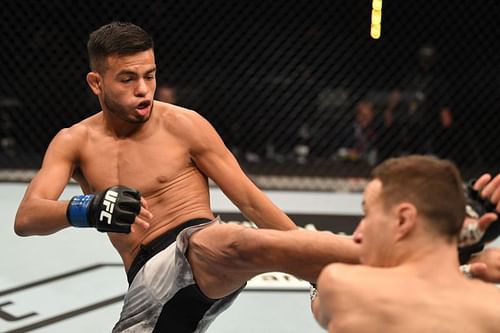 Brandon Royval kicks Kai Kara France of New Zealand in their flyweight bout during UFC 253