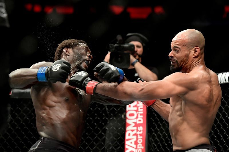 Jared Cannonier of the United States (L) fights against David Branch