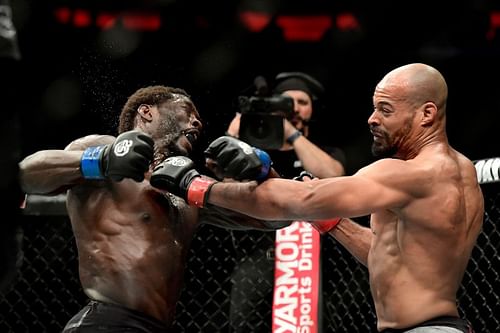 Jared Cannonier of the United States (L) fights against David Branch