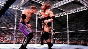 Chris Jericho reacts to his Hell in a Cell match with Triple H in 2002