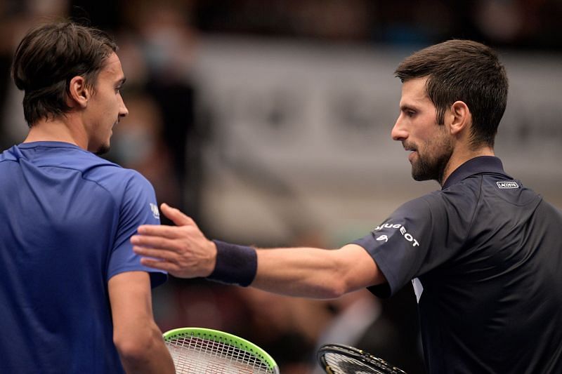 Lorenzo Sonego (L) and Novak Djokovic