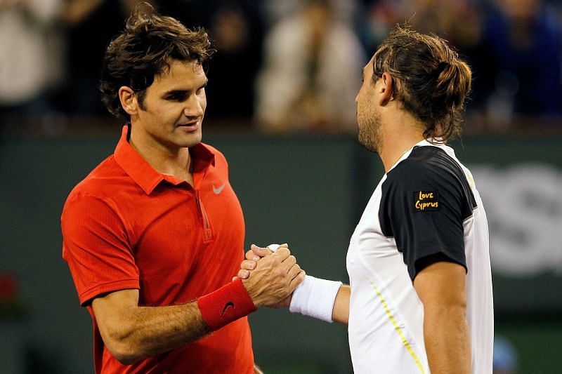 : Roger Federer (L) congratulates Marcos Baghdatis after their Indian Wells 2010 match