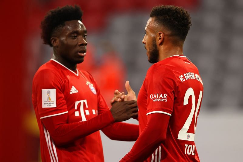 Bayern Munich&#039;s Davies and Tolisso celebrate after a lightning counter-attack was finished in the first half