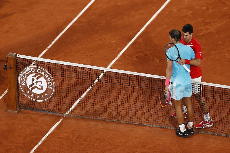 Rafael Nadal and Novak Djokovic embrace after the 2020 French Open final