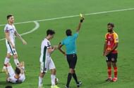 The referee shows yellow card to SC East Bengal striker Balwant Singh (Courtesy: ISL)