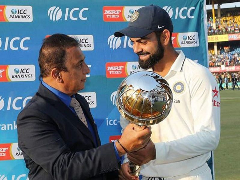 Sunil Gavaskar (L) presenting the ICC Test Championship Mace to Virat Kohli (R) in 2019