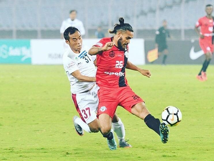 Deepak Devrani (in red) in action