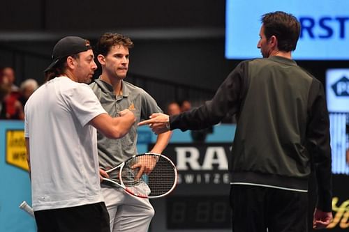 (From left) Nicolas Massu, Dominic Thiem and Wolfgang Thiem chat during a practice session in Vienna