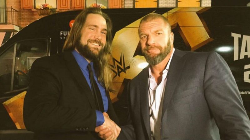 Chris Hero with the man behind WWE NXT, Triple H