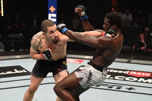  Robert Whittaker of Australia punches Jared Cannonier