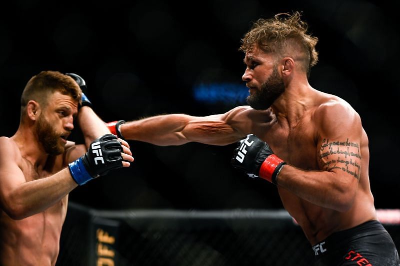 Jeremy Stephens (R) of the United States punches Calvin Kattar (L)
