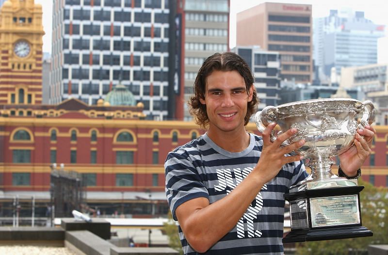 Rafael Nadal poses with the Norman Brookes Challenge Cup after winning the 2009 Australian Open