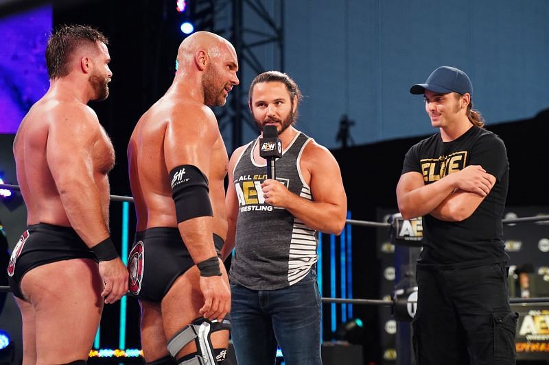 The Young Bucks stand across from FTR in AEW