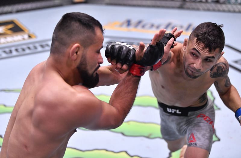 Alex Perez punches Jussier Formiga of Brazil