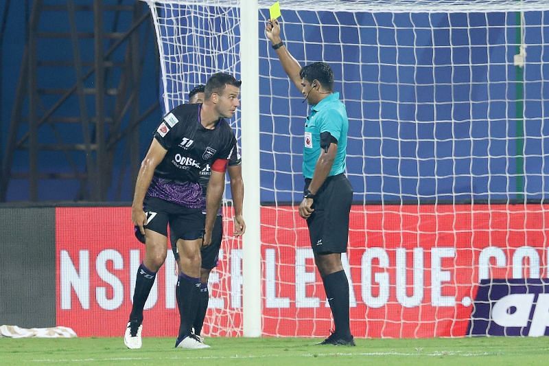 Steven Taylor is shown a yellow card (Image courtesy: ISL Media) 