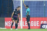 Steven Taylor is shown a yellow card (Image courtesy: ISL Media)