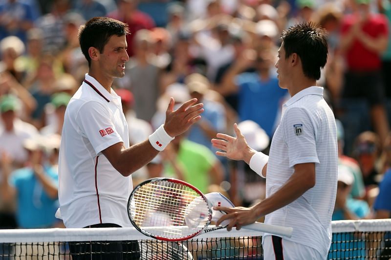 Novak Djokovic (L) and Kei Nishikori at the 2014 US Open