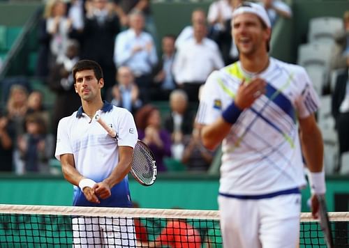 Novak Djokovic (L) and Jurgen Melzer at French Open 2010