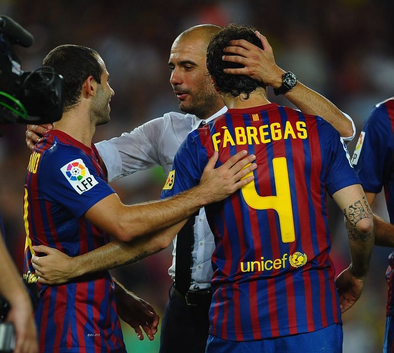 Pep Guardiola celebrates with Cesc Fabregas and Javier Mascherano