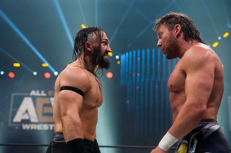 PAC and Kenny Omega exchange some words before exchanging fists