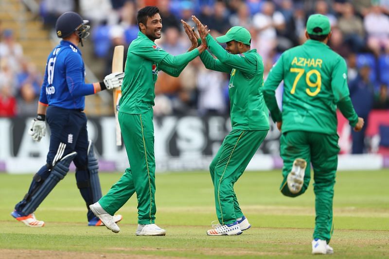Mohammad Amir and Babar Azam celebrate a wicket against England