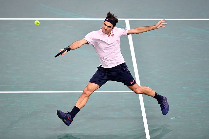 Roger Federer strikes a backhand