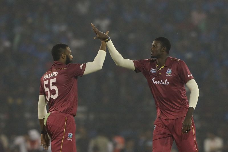 Kieron Pollard (L) and Jason Holder (R) will lead the West Indies&#039; T20I and Test sides respectively.