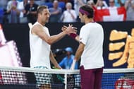 Tennys Sandgren and Roger Federer