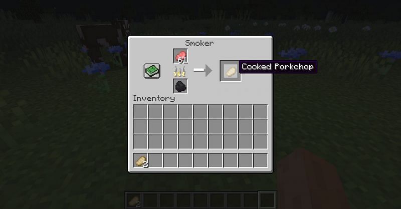 Using a smoker to cook a porkchop in Minecraft. (Image via Minecraft)