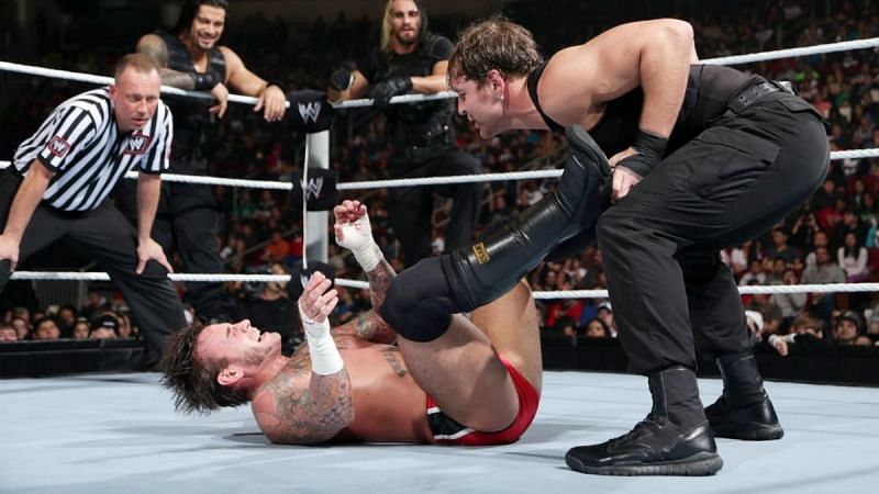 CM Punk and The Shield during their match at TLC 2013