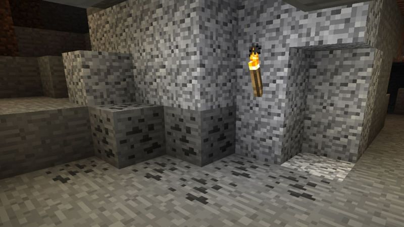 Blocks of coal ore as they appear in Minecraft&#039;s Overworld. (Image via Minecraft.net)