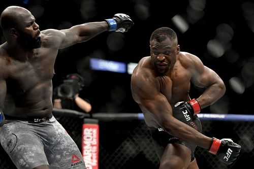 Francis Ngannou (R) of Cameroon misses a punch against Jair Rozenstruik of Suriname