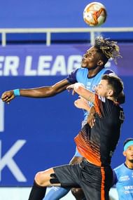 Stephen Eze (in blue) gave Jamshedpur FC the lead in the first half. (Image courtesy: ISL)