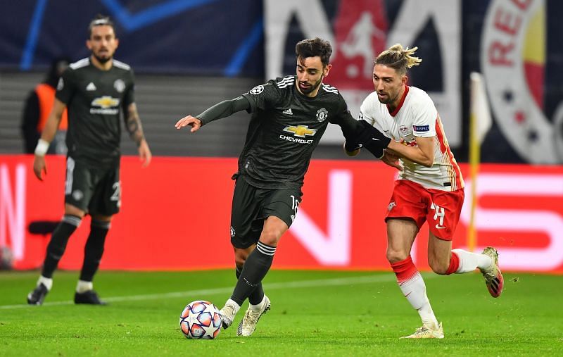 Bruno Fernandes being hassled by Kevin Kampl