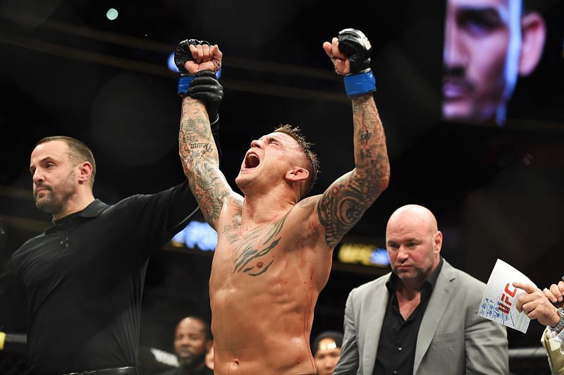 Dustin Poirier celebrates after receiving the interim title