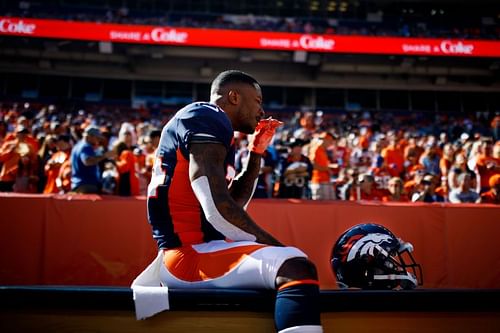 NFL player using smelling salts on the bench